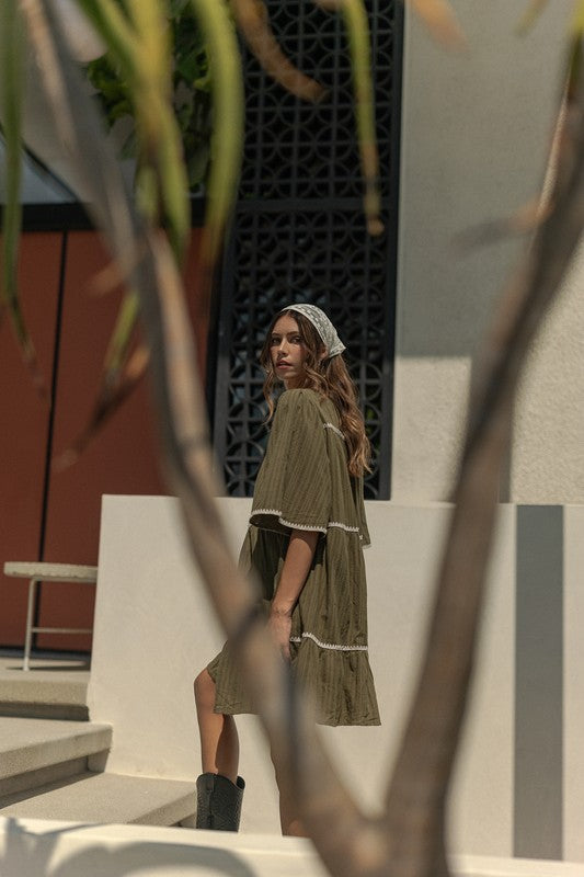 Tassel Contrast Trim Tie Neck Half Sleeve Tiered Dress – Bohemian Tassel Details, Contrast Trim, and Tiered Design for a Flowing, Feminine Look